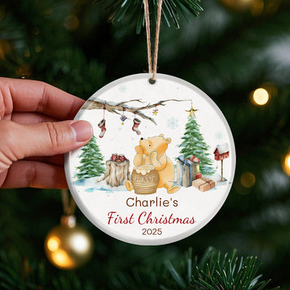 Winnie the Pooh themed baby's first Christmas ornament 2025. Watercolor design with Pooh, hunny pot, and winter scene. Customizable for baby’s first holiday, ideal for Christmas tree decor.