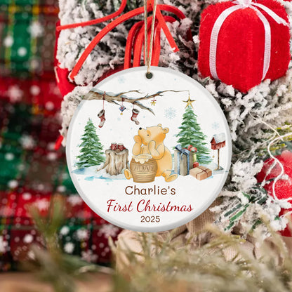 Winnie the Pooh baby's first Christmas ornament 2025. Watercolor design with Pooh, holiday trees, and gifts. Customizable for baby’s first holiday, a sweet seasonal keepsake.