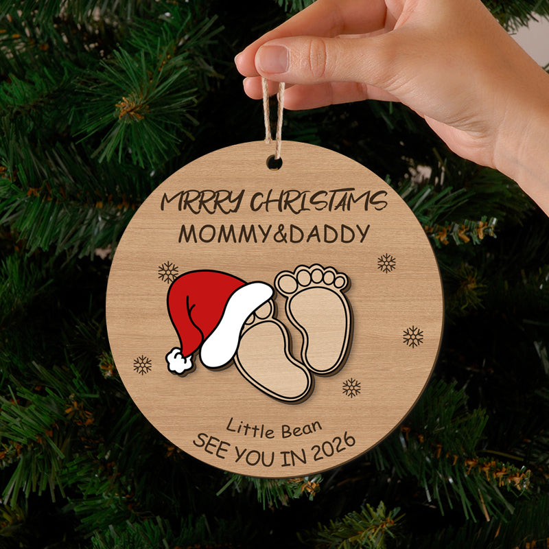 Merry Christmas ornament for Mommy & Daddy with baby footprints and Santa hat, "See You in 2026". Customizable holiday keepsake for new or expecting parents, ideal for Christmas tree decor.