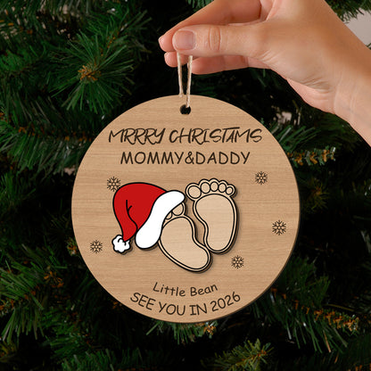 Merry Christmas ornament for Mommy & Daddy with baby footprints and Santa hat, "See You in 2026". Customizable holiday keepsake for new or expecting parents, ideal for Christmas tree decor.