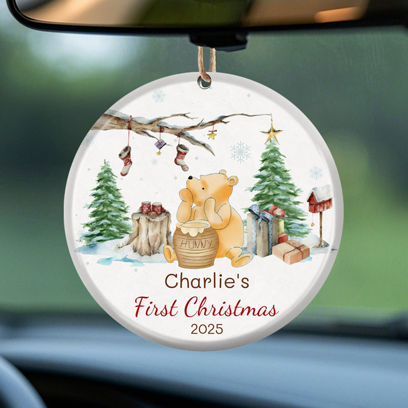 Personalized ornament for baby's first Christmas 2025. Features festive winter scene, Pooh with hunny pot, and customizable name. Perfect holiday gift for new parents.
