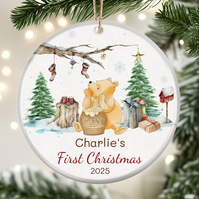 Custom Winnie the Pooh Christmas ornament for baby's first Christmas 2025. Features classic Pooh with hunny pot, winter scene, and personalized name space. Perfect holiday keepsake for new families.