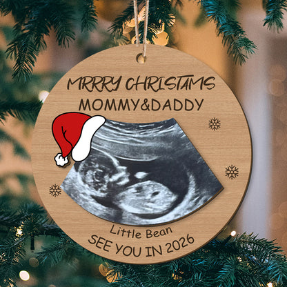 Personalized ultrasound Christmas ornament: "Merry Christmas Mommy & Daddy", "See You in 2026", and Santa hat design. Custom holiday gift for expecting parents, optimized for search engines and customization.