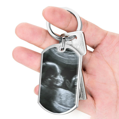 Dad holding personalized ultrasound keychain with dad voice message - unique baby shower present from mom, upload baby’s scan