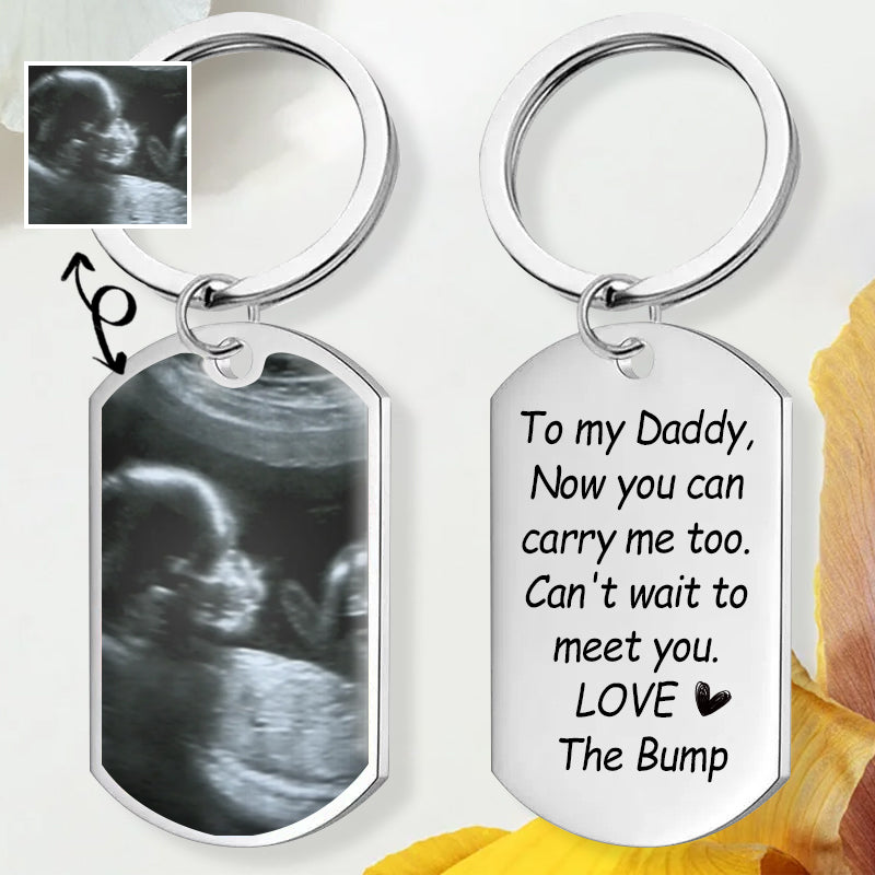 Closeup of custom ultrasound photo keychain - choose mom or dad voice message, customizable baby announcement gift for family